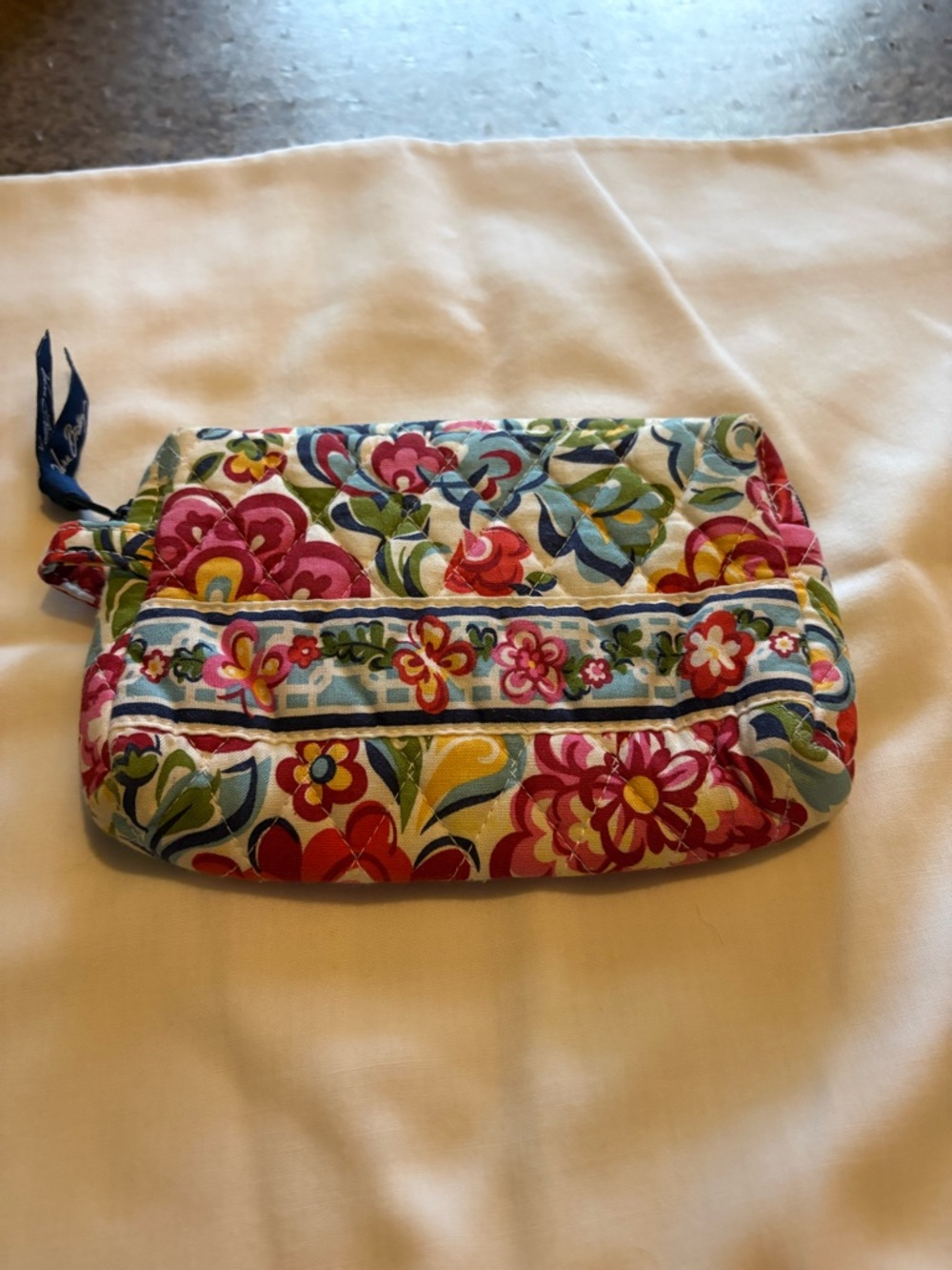 There are barely multicolor floral print clutch bag/make up bag